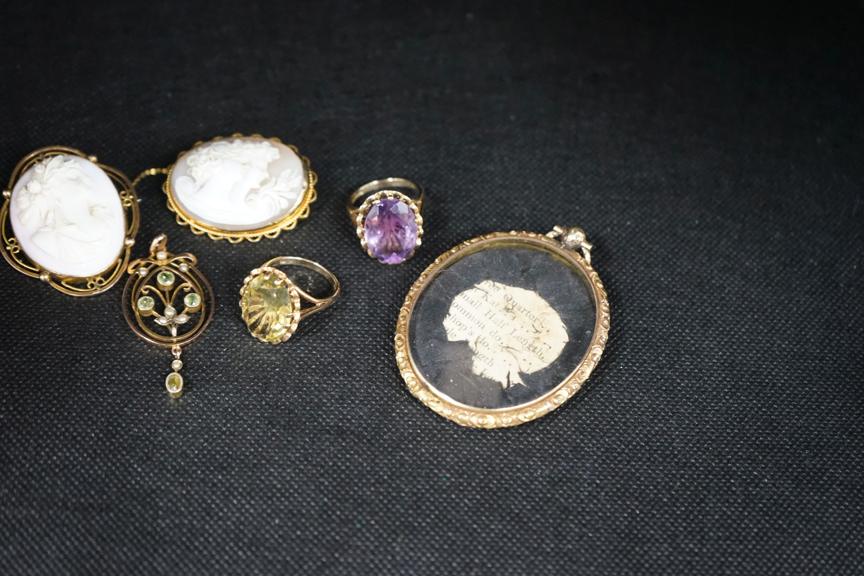 Two modern 9ct gold and gem set rings, a 9ct and gem set pendant, two 9ct mounted cameo shell brooches, gross weight 36.5 grams and a Victorian oval pendant frame, 55mm.